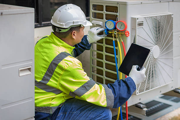 Professional Air Conditioning Repair technician working in Tad, WV
